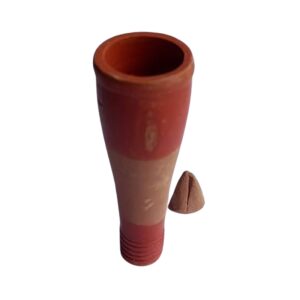Handmade clay chillum for Shiva puja placed on altar